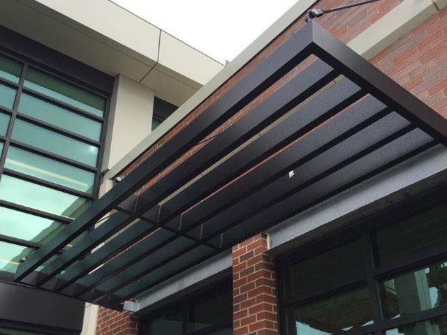 metal awning on brick building